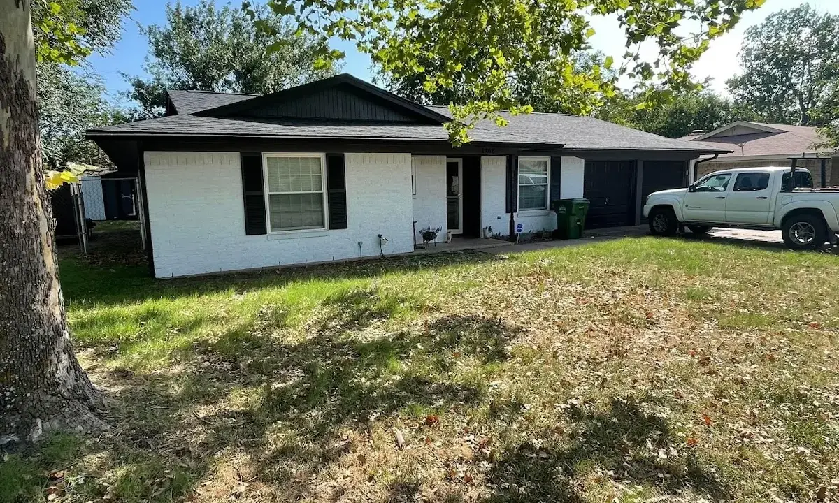 Professional roofing crew working on a residential roof in Pine Castle